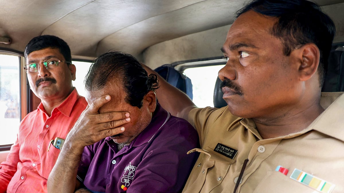 <div class="paragraphs"><p>BEST bus driver Santosh Sawant covers his face, flanked by policemen, inside a police vehicle as he is produced before the Vikhroli court and remanded to police custody till January 3, in Mumbai on Tuesday, Dec. 30, 2025. Sawant was driving the BEST bus that ran over pedestrians in Bhandup on Monday night, killing four people and injuring eight others. (Photo: PTI)</p><p></p></div>