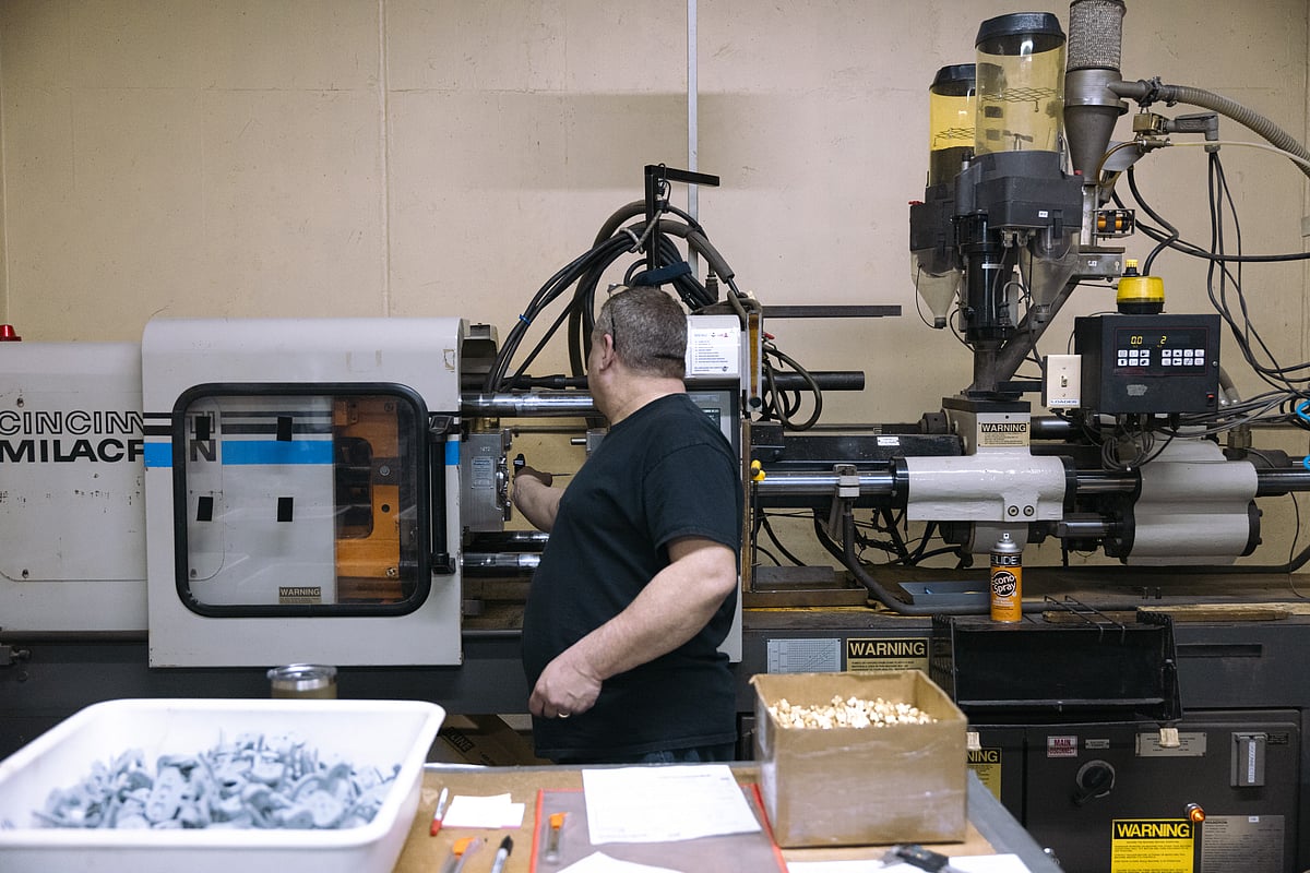 <div class="paragraphs"><p>A worker operates an injection molding machine at a manufacturing facility in Kingston, New York. (Photographer: Angus Mordant/Bloomberg)</p></div>