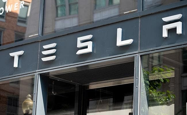 Tesla Inc rose 4.1% to close at $1,054.73.