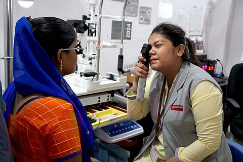 A woman undergoing comprehensive eye screening