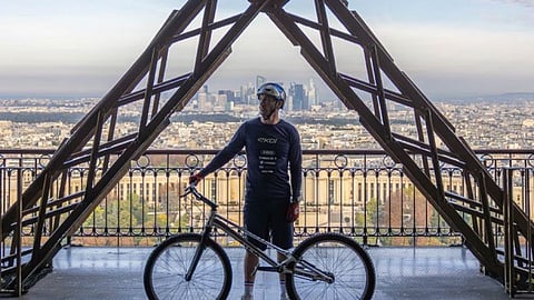TikTok star climbs Eiffel Tower on a bicycle, sets world record
