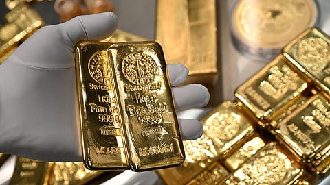 Gold holds its ground as Fed rate-cut expectations cool