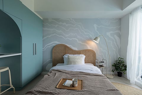 Mirroring beach waves, the room is painted a calming sage green color palette with Pampanga-made pieces. 