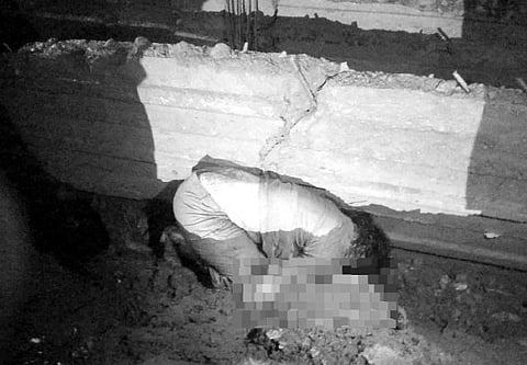 ONE of the four fatalities in the Iloilo road mishap lies motionless near a barrier after a speeding pickup truck rammed the tricycle they were riding on along the national highway in Barangay Oyunga in Iloilo Friday night. | Contributed photo