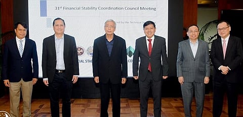 Keeping market steady Bangko Sentral ng Pilipinas Governor Felipe M. Medalla convened the Financial Stability Coordination Council as the new chairman of the Council. In the meeting, Medalla (third from left) is flanked by Insurance Commission Commissioner Dennis Funa (second from right), Securities and Exchange Commission chairperson Emilio Aquino (third from right), and Philippine Deposit Insurance Corporation President Roberto Tan (second from left), who are members of the FSCC Executive Committee. Also present are Finance Undersecretary Zeno Ronald Abenoja (left) and BSP Senior Assistant Governor Johnny Noe Ravalo (right). | Photograph courtesy of BSP