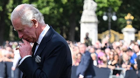 Dearest Mama Britain’s King Charles III looks at floral tributes left outside of Buckingham Palace in London, on 9 September (Manila time), a day after Queen Elizabeth II died at the age of 96. | Ben Stansall / POOL/AGENCE FRANCE-PRESSE