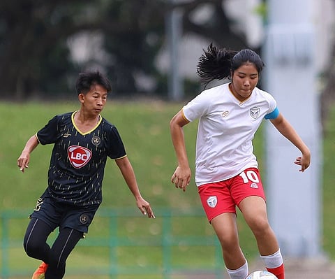 Photograph courtesy of SingaCup
Bhebe Lemoran of Kaya FC-Iloilo (left) puts pressure on a Thai player in their SingaCup Women’s Championship match in Singapore.