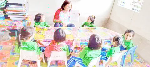 Nenita Riveral teaches young learners at the Barangay Ermita Daycare Center in Cebu City, a facility donated by AboitizPower subsidiary Cebu Private Power Corporation and Aboitiz Foundation Inc.