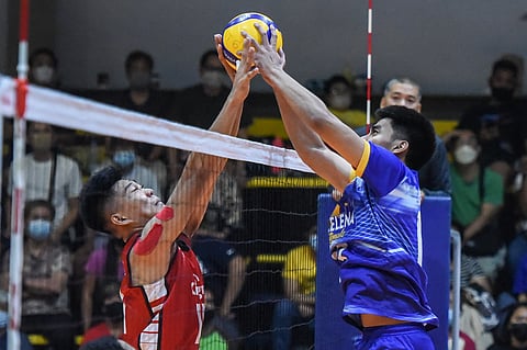 Louie Ramirez of Cignal and NU-Sta. Elena setter Owa Retamar joust at the net during Game 1 of the Spikers’ Turf Open Conference Finals on Thursday. | Photograph COURTESY OF SPIKERS’ TURF 