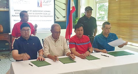 PHOTOGRAPH COURTESY OF JGFP
Junior Golf Foundation of the Philippines officials, led by president Oliver Gan (left) and chairman emeritus Tommy Manotoc (second from left) sign the memorandum of agreement making the Eagle Ridge Golf and Country Club as home of the JGFP. Also in photo are JGFP executive director Jun Cedo (second from right) and JGFP treasurer AJ Adiviso (back), Eagle Ridge general manager Antonio Ocampo and director Ramil Villanueva.
