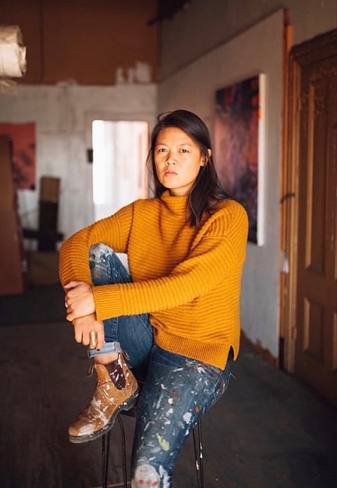 PHOTOGRAPH COURTESY OF IG/JANA BENITEZ
Jana taking a break in her Maine studio.