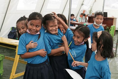 CHILDREN enjoying their learning and play time. | PHOTOGRAPHS COURTESY OF UNICEF