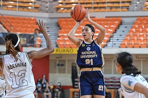 NU's Camille Clarin shoots a jumper against Adamson center Victoria Adeshina during their UAAP Season 85 women's basketball match. The Lady Bulldogs overpower the Lady Falcons, 101-55. Photo courtesy of UAAP