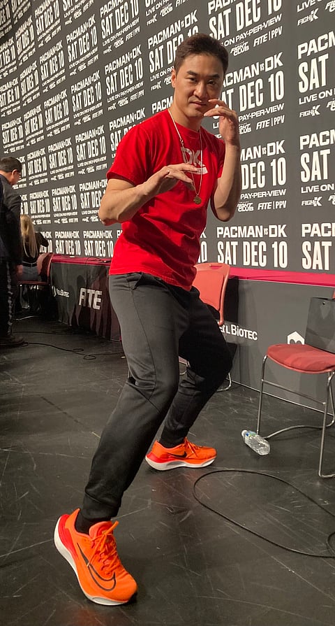 DK Yoo takes a page from Bruce Lee with this iconic pose during Saturday’s official weigh-in at the KINTEX in Goyang, a city just outside Seoul. | Photograph by NICK GIONGCO for the daily tribune
