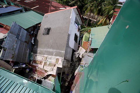A four-story building in Barangay Longos, Malabon City crumbles on Sunday morning. Investigators said that a weak foundation was the culprit on the collapse. | Photograph by Analy Labor for the daily tribune @tribunephl_ana