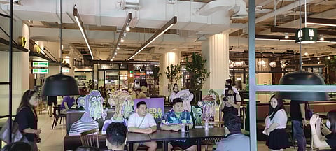 Patrons enjoying their meal at the new comfort food haven.