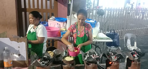 SITUATED in front of the San Sebastian Parish in Barangay Pinagbuhatan, Eduardo’s Bibingka offers kakanin that are popular during the Christmas season. Above, two cooks start preparing the native delicacies. | Photograph by Neil Alcober for the Daily Tribune