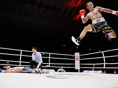 Joey Canoy (right) explodes in celebration after knocking out Kenichi Horikawa in their fight for the vacant 
Orient-Pacific Boxing Federation light-flyweight title on Sunday in Osaka, Japan. | PHOTOGRAPH COURTESY OF Sanman Promotions