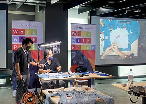 PHOTOGRAPH COURTESY OF TELUS
SoFA design instructor and fashion designer Fred Telarma during the Design Your Own Pride Jacket activity.