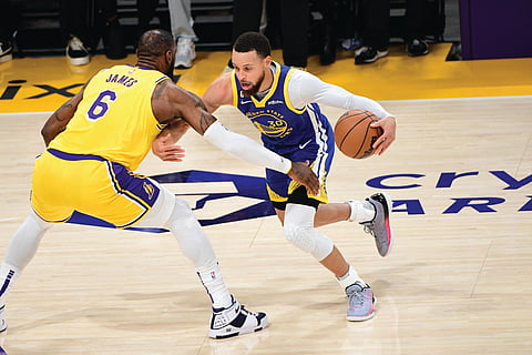 Adam Pantozzi/AGENCE FRANCE-PRESSE
LOS ANGELES star LeBron James (left) plays defense against Stephen Curry of Golden State during the Western Conference semifinals of the 2023 NBA Playoffs at Crypto.Com Arena in Los Angeles, California on Friday.
