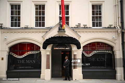 A faux moustache is pictured above the entrance to  Sotheby's auctioneers in Londonb ahead of a press preview for their "Freddie Mercury: A World of His Own" auctions. (Photo by Daniel LEAL / AFP)
