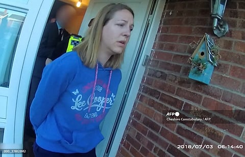A handout image taken from police bodycam footage released by Cheshire Constabulary police force in Manchester on August 17, 2023, shows the nurse Lucy Letby being arrested at home in Chester on July 3, 2018. Photo by Cheshire Constabulary / AFP