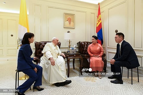 This handout photo taken and released by Vatican Media on 1 September 2023 shows Pope Francis (2nd L) talking to Mongolia's Minister of Foreign Affairs Batmunkh Battsetseg (2nd R) during their meeting in Ulaanbaatar. (Photo by Handout / VATICAN MEDIA / AFP)