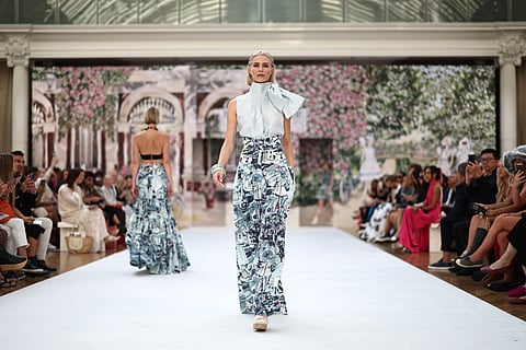 A model presents a creation by Irish designer Paul Costelloe during a catwalk presentation for his Spring/Summer 2024 collection (SS24) during London Fashion Week in London on 15 September 2023. (Photo by HENRY NICHOLLS / AFP)