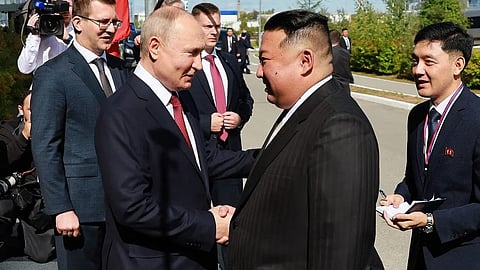 In this pool photo distributed by Sputnik agency, Russia’s President Vladimir Putin (Centre L) shakes hands with North Korea’s leader Kim Jong Un (2nd R) during their meeting at the Vostochny Cosmodrome in Amur region on September 13, 2023. (AFP)
