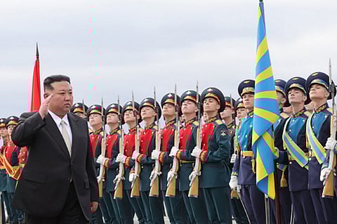 In this handout photograph distributed by the Russian Defense Ministry, North Korea's leader Kim Jong Un inspects Russian honor guards as he arrives at Knevichi aerodrome near Vladivostok, Primorsky region, on 16 September 2023. (Photo by Handout / Russian Defense Ministry / AFP)