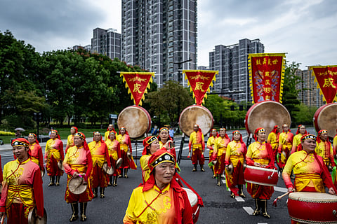 PHILIP FONG/AGENCE FRANCE-PRESSE
Participants in the torch relay show host city Hangzhou’s readiness for the staging of the 19th Asian Games.