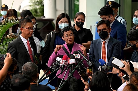 FILE: Nobel Laureate Maria Ressa speaks to members of the media after she was acquitted of the tax evasion cases against her at the Court of Tax Appeals in Quezon City, Metro Manila on 18 January 2023. Photo by JAM STA ROSA / AFP.

