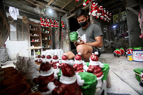 Raining Santas As the weather begins to cool, out come Santas and the elves. Filipino homes will soon be dressed up with holiday decors, and workers at a Christmas production facility in Angono, Rizal, are hard at work producing items for the expected rush. | PHOTOGRAPH BY ANALY LABOR FOR THE DAILY TRIBUNE @tribunephl_ana