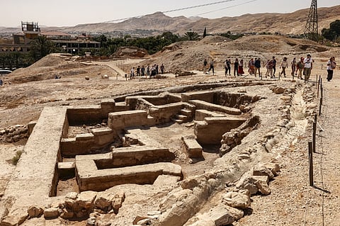 Tourists visit the pre-historic site of Tell al-Sultan, which was recently added to the UNESCO World Heritage List, near the Palestinian city of Jericho in the occupied West Bank on 27 September 2023. (Photo by HAZEM BADER / AFP)