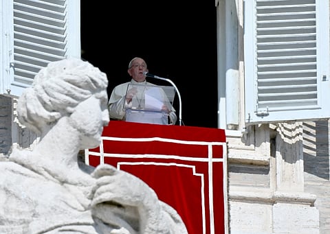 Pope Francis addresses his message to the pilgrims gathered in St. Peter's Square during his Sunday Angelus prayer at the Vatican on 8 October 2023.(Photo by Filippo MONTEFORTE / AFP)