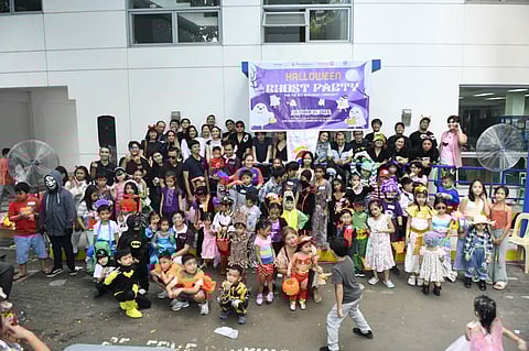 photograph courtesy of RC Makati
For the second consecutive year, Guadalupe Viejo kids were treated to a fun-filled Halloween Ghost Party by both the Rotary Club of Makati and the Publicis Group’s creative digital content outfit, Prodigious Philippines. Photo shows RC Makati members led by District Governor-Nominee Reggie  Nolido and his wife, Sue Ann;  Dir. Neil and Camillie Makasiar; past president JunJun and Cecille Dayrit; Rotarians Boy Arteche; and Philip Soliven with members of the Rotaract Club of Makati led by president Adrian Manuel; RCC Bukluran members led by President Mike Alba; and the team from Prodigious Philippines with Guadalupe Viejo kids. 