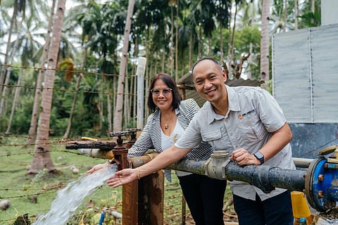 Remote communiy empowered One Meralco Foundation  energizes Barangay Sibaltan’s main source of water with solar energy under its Water Access Electrification Program. At the project site are (from left) El Nido Mayor Edna GacotLim and OMF president Jeffrey O. Tarayao. | photograph courtesy of One Meralco Foundation