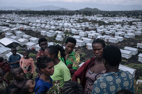 ALEXIS HUGUET/Agence France-Presse
WOMEN gather on a hill in the Rusayo IDP camp, home to tens of thousands of war-displaced people, on the outskirts of Goma, eastern Democratic Republic of Congo. Every month, over 2,000 women are treated in IDP camps all around the city by Doctors Without Borders.