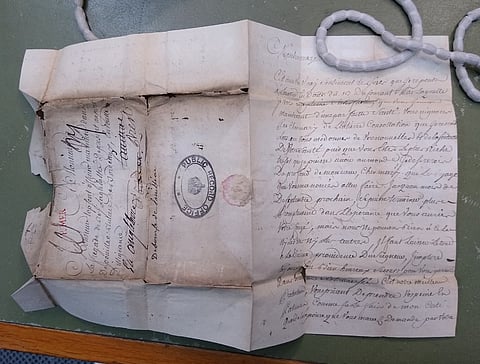 An undated handout photograph taken by The National Archives and released by the University of Cambridge on 2 November 2023 shows a love letter from Anne Le Cerf, a.k.a. Nanette, to her husband Jean Topsent. Undelivered letters written to French sailors during an 18th century war between Britain and France have finally been opened and studied -- after more than 250 years of gathering dust. The unread letters have provided a rare insight into the lives of sailors and their families in the 1700s, from the wife of a senior naval officer to an elderly mother chastising her son for not writing. (Photo by Renaud Morieux / THE NATIONAL ARCHIVES / AFP) 