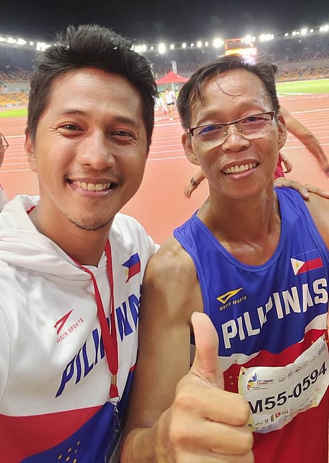 Emerson Obiena (right) tops the 55-59 category in the Asian Masters Athletics Championships at the New Clark City in Capas, Tarlac. Joining him is another gold medalist, Djundi Binas, in the 40-44 class. | Photograph COURTESY OF Pilipinas Run-Jump-Throw