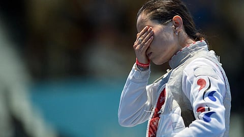 Olympic silver medallist Nam Hyun-hee has been barred from leaving South Korea, police said Tuesday, as a high-profile fraud probe into her ex-fiance drags in the former fencer. (Photo: ALBERTO PIZZOLI / AFP)