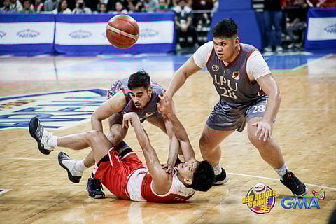 PHOTOGRAPH COURTESY OF NCAA
OLIVER Tagle of San Beda tries to keep the ball away from Mclaude Guadaña and Shawn Umali of Lyceum during their Season 99 NCAA men’s basketball tournament Final Four encounter.
