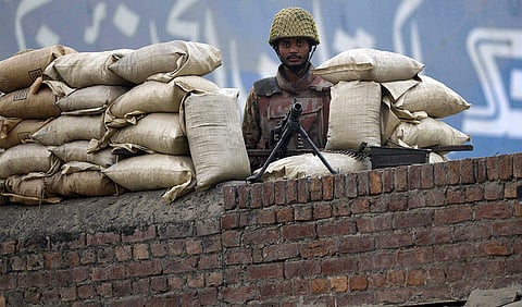 (FILE PHOTO) A Pakistani soldier stands guard at a checkpost near the Kot Lakhpat Jail on the outskirts of Lahore. (Photo: AFP)