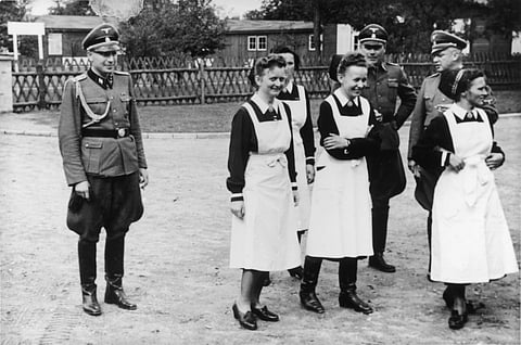 FILE PHOTO: SS officers and German nurses gather during the dedication ceremony of the new SS hospital in Auschwitz on 1 September 1944. (Photo credit: United States Holocaust Memorial Museum, courtesy of Anonymous Donor)