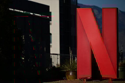 The Netflix logo is displayed at the entrance to Netflix Albuquerque Studios film and television production studio lot in Albuquerque, New Mexico on 13 October 2023. (Photo by Patrick T. Fallon / AFP)