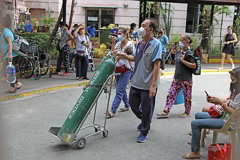 FILE: Patients wait inside the compound of the Philippine General Hospital for services on 13 September 2022. |        📷 Joey Sanchez Mendoza