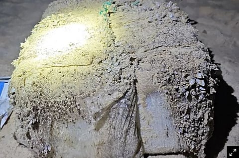 A first batch of 39 barnacle-encrusted, one-kilogram bricks of suspected cocaine was discovered near Magenta Beach, north of Sydney, police said. (Photo: New South Wales Police)