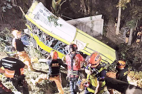 ILOILO CITY DISASTER RISK REDUCTION AND MANAGEMENT OFFICE/AGENCE FRANCE-PRESSE RESCUERS work against the clock in helping injured passengers get off the wreckage of a passenger bus that plunged into a ravine in Antique on Tuesday after getting off its lane.