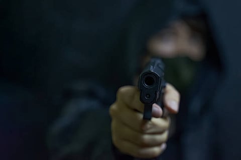 Son had mom, lover killed, says hitman