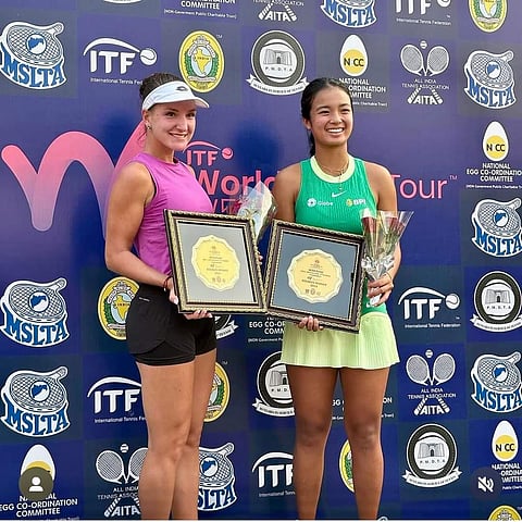 Alex Eala and her Latvian doubles partner Darja Semenistaja show off their latest hardware after winning in the W50 Pune in India. | PHOTOGRAPH COURTESY OF Alex Eala/FB